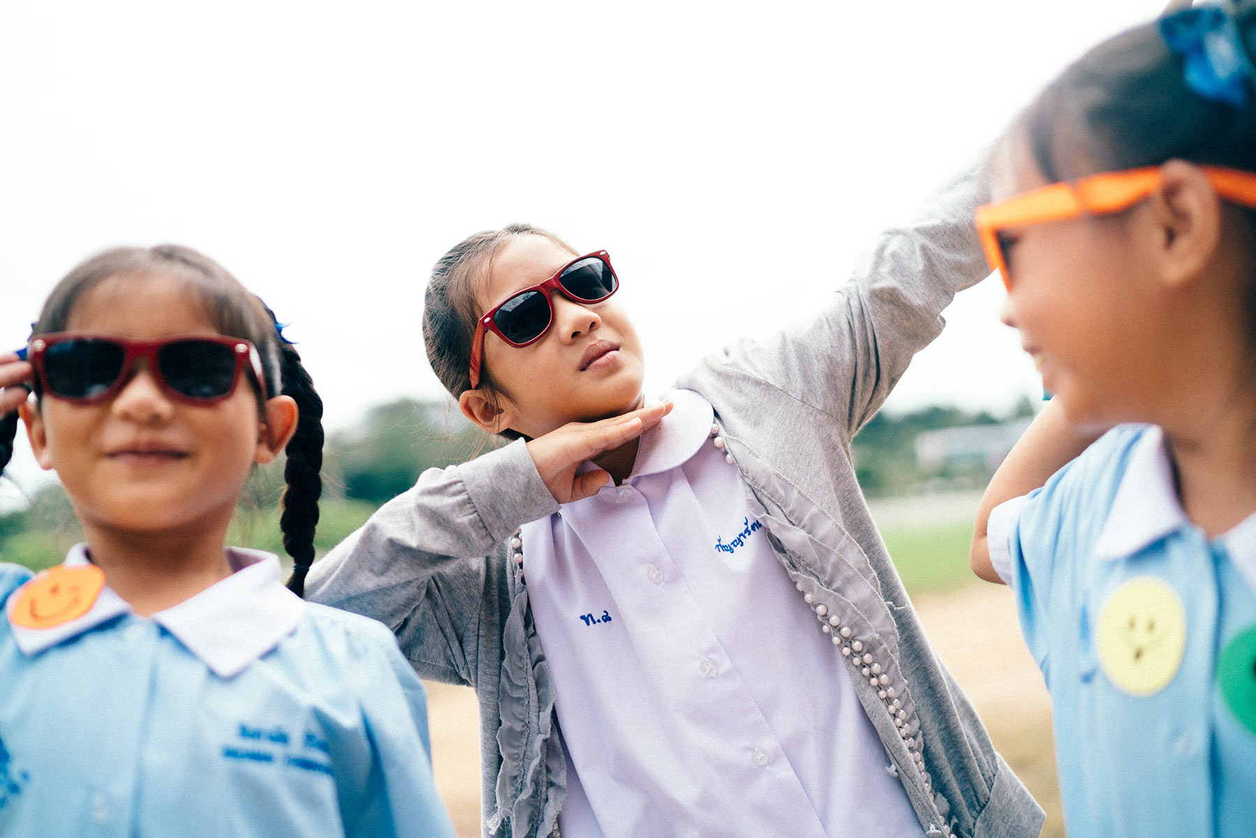 Three-young-girls-wearing-sunglasses-and-acting-silly